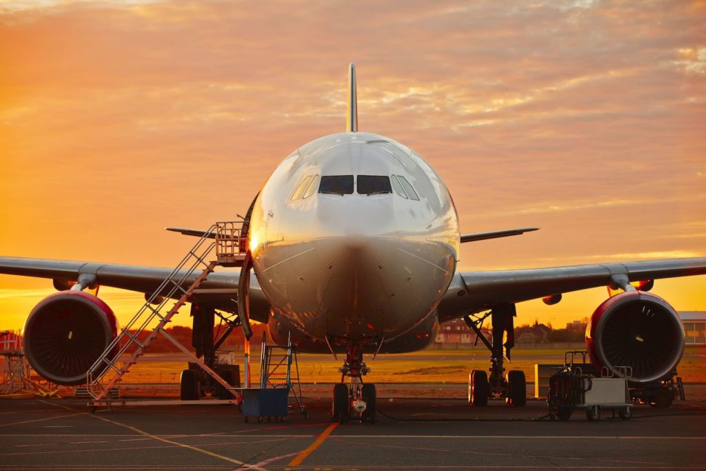 Aircraft service - large aircraft at the beautiful sunrise